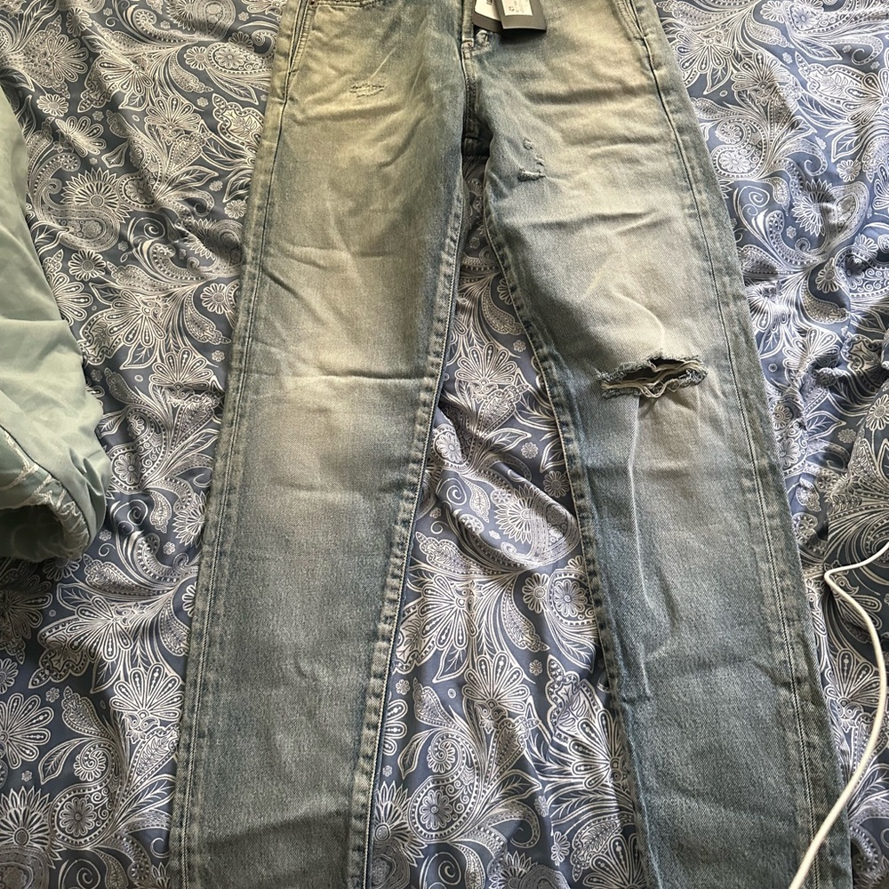 Brand new saint laurent distressed jeans